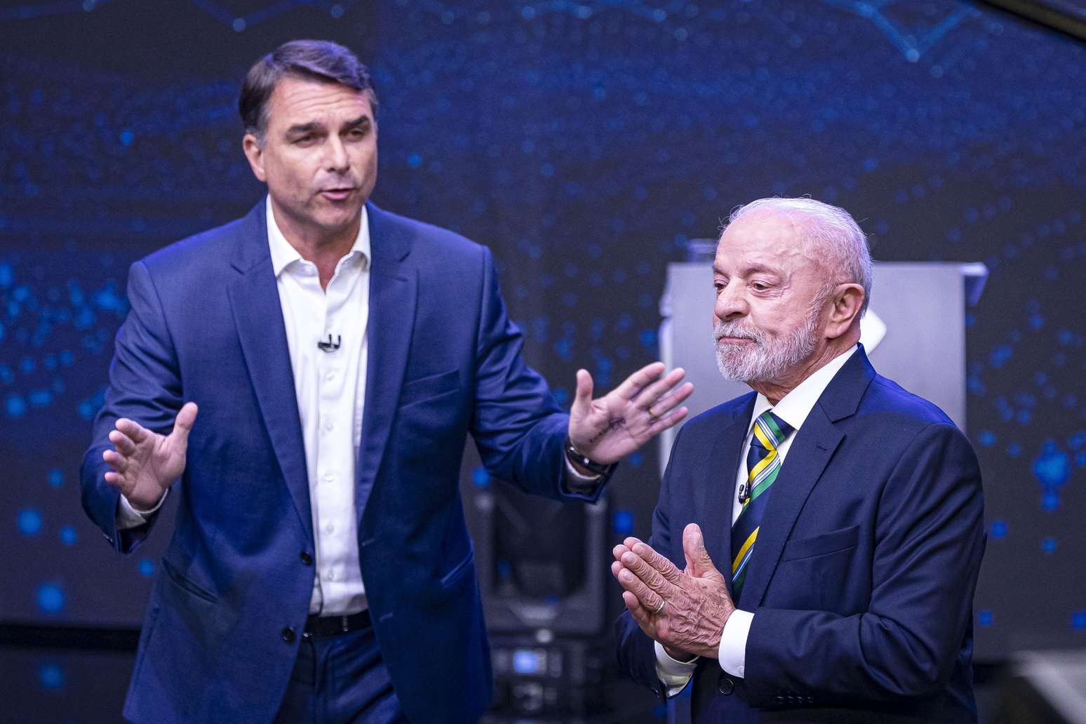 Lula e Flávio Bolsonaro durante debate da Band